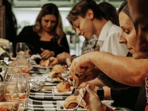 Group eating food at binksberry hollow event